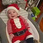Baby & Toddler Clothing, Sleeve, Baby, Sourire, Headgear, Lap, Sock, Bambin, Cap, Santa Claus, Enfant, Holiday, Fictional Character, Chair, Carmine, NoÃ«l, Chapi Chapo, Assis, Comfort, Baby Products, Personne, Headwear