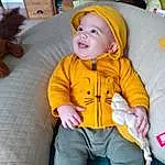Head, Sourire, Yeux, Couch, Comfort, Baby & Toddler Clothing, Orange, Baby, Bambin, Bois, People, Jacket, Enfant, Fun, Jouets, Lap, Assis, Cap, Personal Protective Equipment, Pumpkin, Personne, Headwear