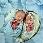 Comfort, Azure, Textile, Baby, Baby & Toddler Clothing, Happy, Gesture, Rose, Aqua, Baby Sleeping, Bambin, Petal, Enfant, Linens, People In Nature, Picture Frame, Event, Pattern, Baby Products, Personne