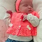 Clothing, Jeans, Peau, Lip, Trousers, VÃªtements dâ€™extÃ©rieur, Bras, Human Body, Textile, Neck, Sleeve, Baby & Toddler Clothing, Rose, Waist, Finger, Headgear, Red, People, Baby, Baby Sleeping, Personne, Headwear