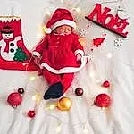 Textile, Sleeve, Santa Claus, Happy, Baby & Toddler Clothing, Holiday, Christmas Decoration, Event, Costume Hat, Sourire, NoÃ«l, Arbre, Baby, Christmas Ornament, Christmas Eve, Lap, Bambin, Hiver, Carmine, Fictional Character, Personne, Headwear