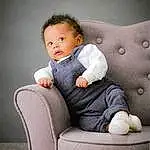 Hair, Joue, Head, Lip, Meubles, Comfort, Flash Photography, Sleeve, Baby & Toddler Clothing, Couch, Baby, Bambin, Assis, Chair, Room, Club Chair, Enfant, Magenta, Thigh, Portrait Photography, Personne