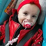 Clothing, Visage, Lip, VÃªtements dâ€™extÃ©rieur, Mouth, Baby & Toddler Clothing, Sleeve, Baby Carriage, Happy, Baby, Rose, Bambin, Red, Cool, Fun, Baby Products, Personal Protective Equipment, Car Seat, Enfant, Personne, Joy, Headwear