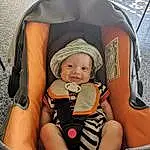 Comfort, Orange, Baby & Toddler Clothing, Yellow, Chair, Baby, Lap, Thigh, Personal Protective Equipment, Bambin, Baby Carriage, Boats And Boating--equipment And Supplies, Fun, Enfant, Baby Products, Baby Safety, Leisure, Assis, Recreation, Personne, Joy, Headwear