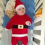 VÃªtements dâ€™extÃ©rieur, Blanc, Santa Claus, Textile, Sleeve, Baby & Toddler Clothing, Red, Christmas Decoration, Baby, NoÃ«l, Lap, Bambin, Event, Fictional Character, Holiday, Linens, Costume Hat, Thigh, Carmine, Christmas Eve, Personne, Headwear