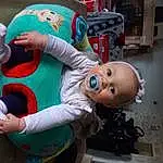 Gesture, Jouets, Happy, Fun, Enfant, Fictional Character, Event, Sourire, Déguisements, Carmine, Sock, Assis, Doll, Stuffed Toy, Human Leg, Knee, Animation, Room, Lap, Baby Toys, Personne